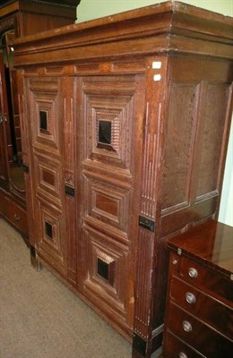 Lot 816 - Continental panelled oak wardrobe