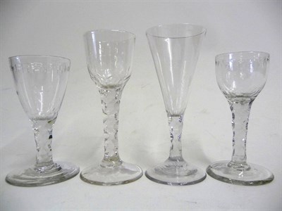 Lot 15 - A Group of Four Facet Stem Drinking Glasses, late 18th century, comprising two with ogee bowl,...