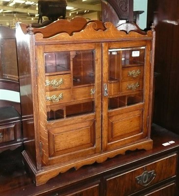 Lot 818 - A walnut smoker's cabinet