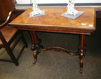 Lot 832 - A Victorian walnut fold over tea table