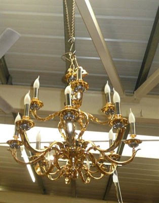 Lot 833 - A large modern chandelier, matching chandelier and three wall lights