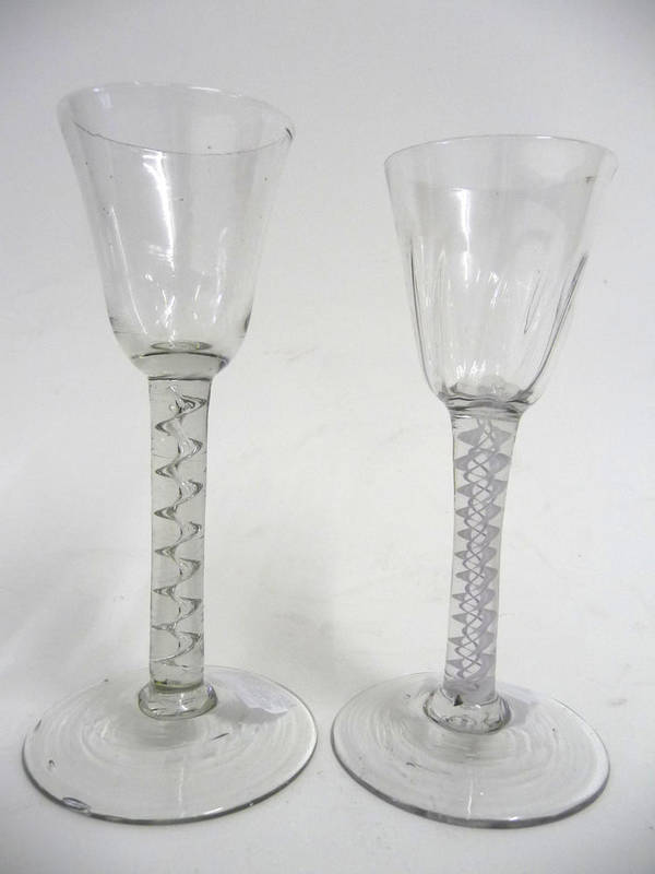 Lot 23 - A Wine Glass, circa 1765, the rounded funnel bowl with basal fluting, on a double series opaque...