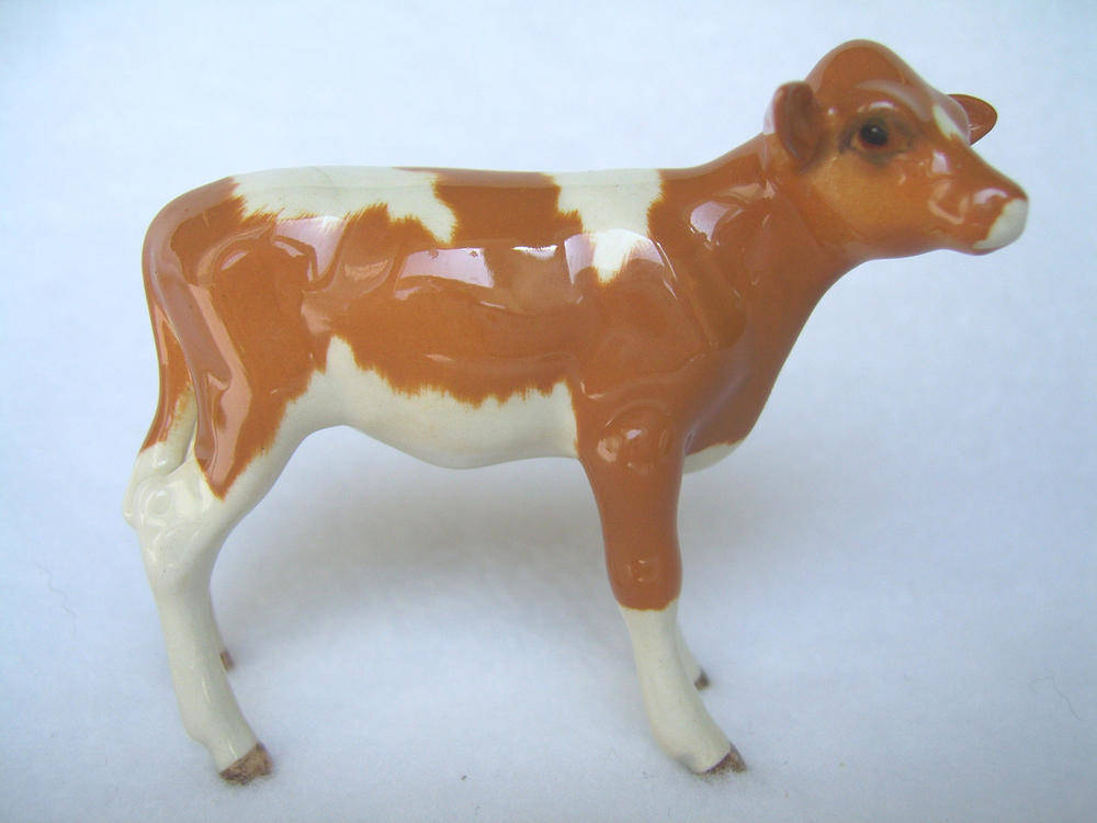 Lot 1071 - Beswick Guernsey Calf, model No. 1249A, golden brown and white gloss, 7cm high