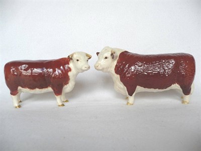 Lot 1074 - A Beswick Hereford Bull, model No. 1363B, 10.8cm high and a Beswick Hereford Cow, model No....