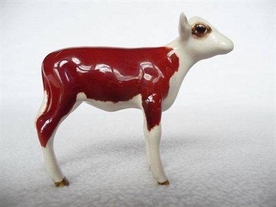 Lot 1075 - A Beswick Hereford Calf, model No. 1249E, brown and white gloss, 7cm high