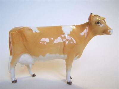 Lot 1087 - A Beswick Guernsey Cow, model No. 1248B, tan and white gloss, 10.8cm high