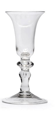 Lot 27 - A Balustroid Wine Glass, circa 1740, the bell bowl on a flattened and tiered cushion upper...