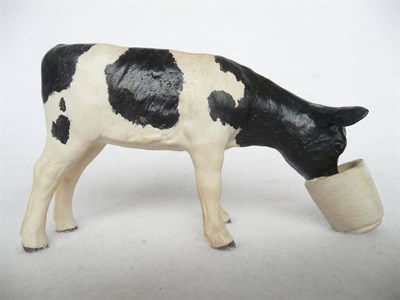 Lot 1104 - Shebeg Pottery Friesian Calf with head in bucket, black and white matt, 8.2cm high