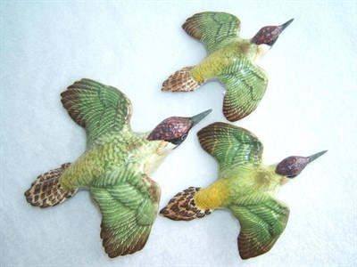 Lot 1110 - Set of three graduated Beswick Green Woodpecker wall plaques, models 1344/1 (restored beak); 1344/2