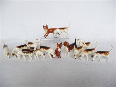 Lot 1115 - Eleven Beswick Foxhounds, models 943 x 2; 944; 2262; 2263; 2264 x 4; 2265 x 2, Standing Fox,...