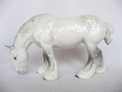 Lot 1138 - Beswick grey grazing Shire Horse, model No. 1050, gloss, 14cm high (small ear chips)