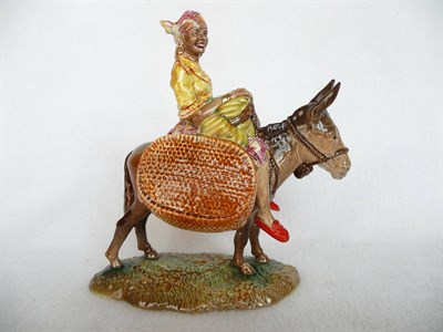 Lot 1146 - Beswick 'Susie Jamaica' on a Donkey, model No. 1347, girl wearing yellow blouse and red...