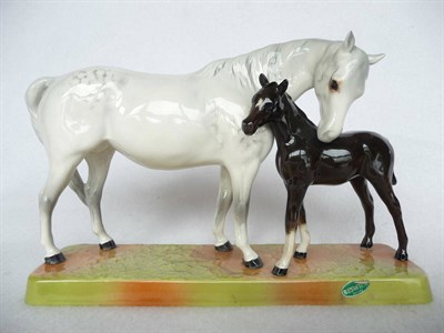 Lot 1148 - Beswick grey Mare and dark brown Foal on pottery plinth, model No. 1811, gloss, 15cm high