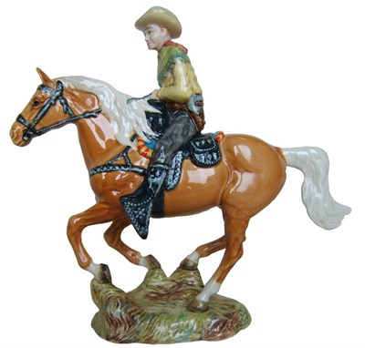 Lot 1154 - A Beswick Canadian Mounted Cowboy on galloping Palomino Horse, model No. 1377, gloss, 22.2cm high