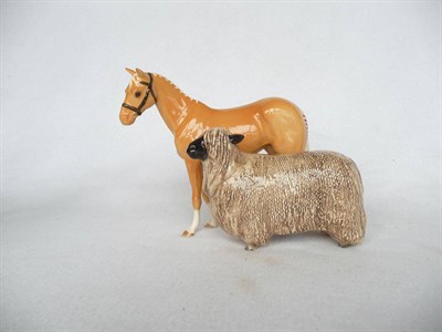 Lot 1158 - A Beswick Palomino Pony, model No. H259, gloss, 17.2cm high and a Beswick Wensleydale Sheep,...