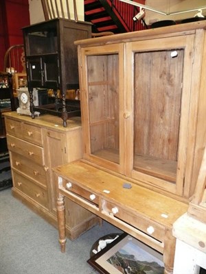 Lot 1180 - A pine four height chest, a two draw kitchen table and a glazed cabinet