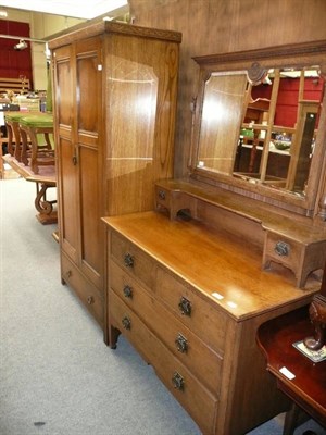 Lot 1183 - A modern extending dining table, a small glazed cabinet, an oak wardrobe and dressing table