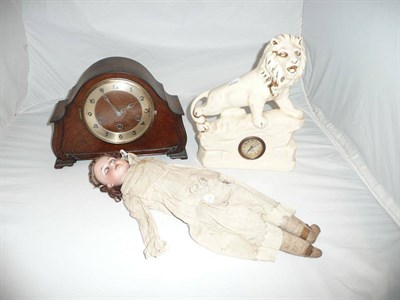Lot 4 - Armand Marseille doll, lion clock and an oak clock