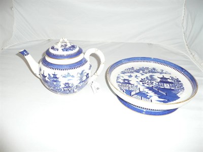 Lot 6 - A Royal Worcester cheese stand and a teapot and cover