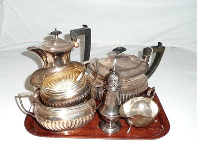 Lot 7 - A silver sauceboat, a four piece electroplated tea set and a plated caster