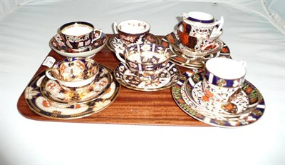Lot 9 - Tray of Royal Crown Derby trios, cups and saucers, milk jug and sugar bowl and matching saucer, two