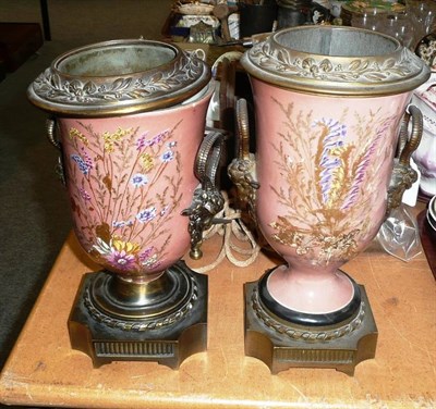 Lot 45 - Two pink porcelain gilt metal mounted oil lamp bases with painted floral decoration