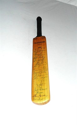 Lot 69 - A Miniature Slazenger Cricket Bat, signed by fourteen members of the 1970's Australian touring...