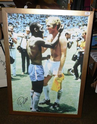 Lot 73 - A Reproduction Canvas Print of Pele and Bobby Moore, hand signed by Pele, framed, 88cm by 61cm,...
