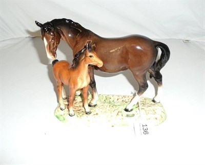 Lot 136 - Beswick horse and foal on pottery plinth
