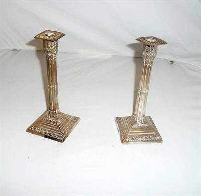 Lot 137 - Pair of loaded silver candlesticks