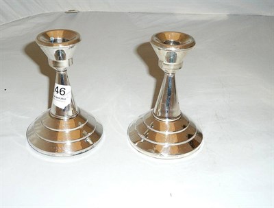 Lot 146 - Pair of silver squat candlesticks