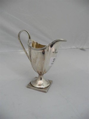 Lot 162 - A Victorian silver cream jug, London assay 1880