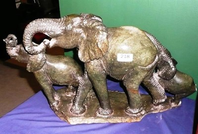 Lot 218 - An African Carved Greenstone Group of Three Elephants, signed Miko Makano