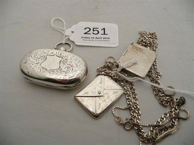 Lot 251 - Silver sovereign case and two stamp envelopes on chains