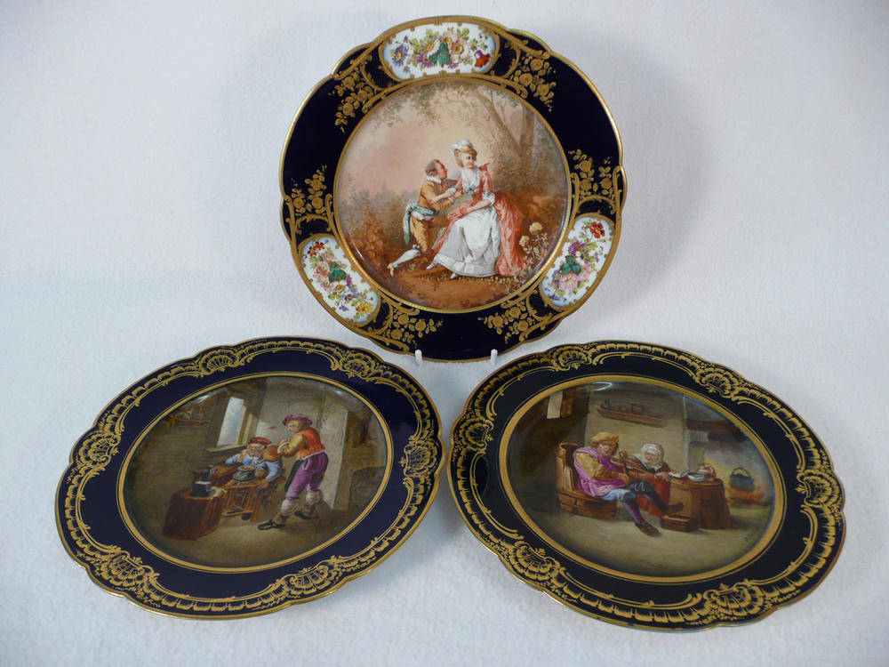 Lot 83 - A Pair of "Sevres" Porcelain Dessert Plates, painted after David Teniers, circa 1880, each of lobed