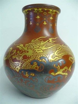 Lot 112 - A Japanese Lacquered Porcelain Dumpy Baluster Vase, late Meiji Period (1868-1912), the tomato...