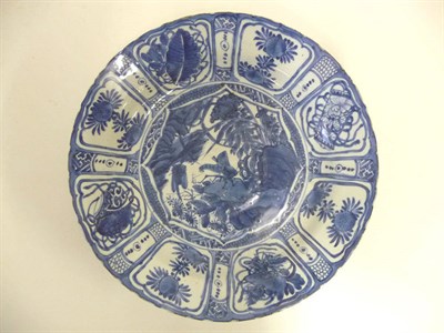 Lot 131 - A "Kraak Porselein" Dish, circa 1610, decorated in underglaze-blue with a grasshopper perched...