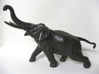 Lot 139 - A Japanese Bronze Model of a Bull Asian Elephant, Meiji Period (1868-1912), running forward and...