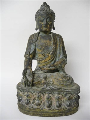 Lot 141 - A Tibetan Bronze Figure of Sakyamuni, 18th/19th century, serenely seated in meditation, his hair in