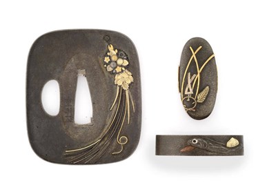 Lot 145 - A Japanese Tsuba, 19th century, shibuichi, rounded rectangular, inlaid with foliate tasselled...