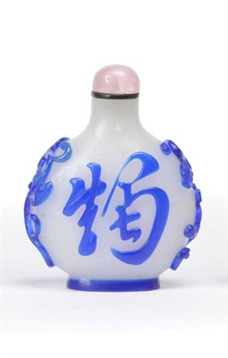 Lot 151 - A Blue Overlay Chinese Snuff Bottle, 18th/19th century, the cream coloured ground overlaid in...