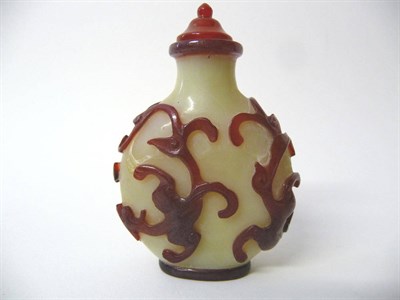 Lot 154 - A Chinese Red Overlay Glass Snuff Bottle, 18th/19th century, the cream body overlaid in red and...