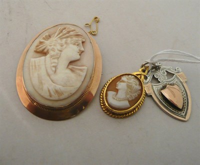 Lot 69 - Gold cameo brooch, small cameo and a silver pendant