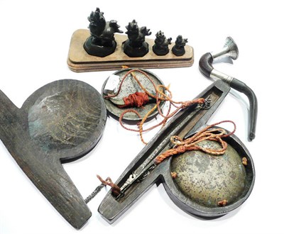 Lot 82 - Set of four Burmese bronze 'duck' form 'opium' weights, a set of scales (cased) and a pipe