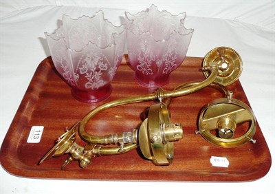 Lot 113 - Pair of brass wall lights with cranberry glass shades
