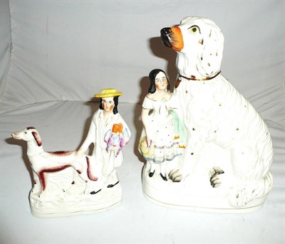 Lot 120 - A Staffordshire group of a spaniel and a young girl and another of a greyhound and gent