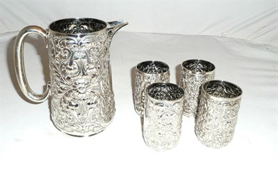 Lot 130 - A silver jug and four beakers