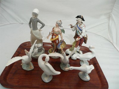 Lot 142 - Five Lladro swans/geese, a Lladro girl and two Continental figures (8)