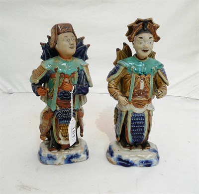 Lot 181 - A pair of stoneware figures, possibly Tibetan