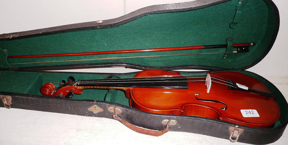 Lot 242 - A cased violin and bow